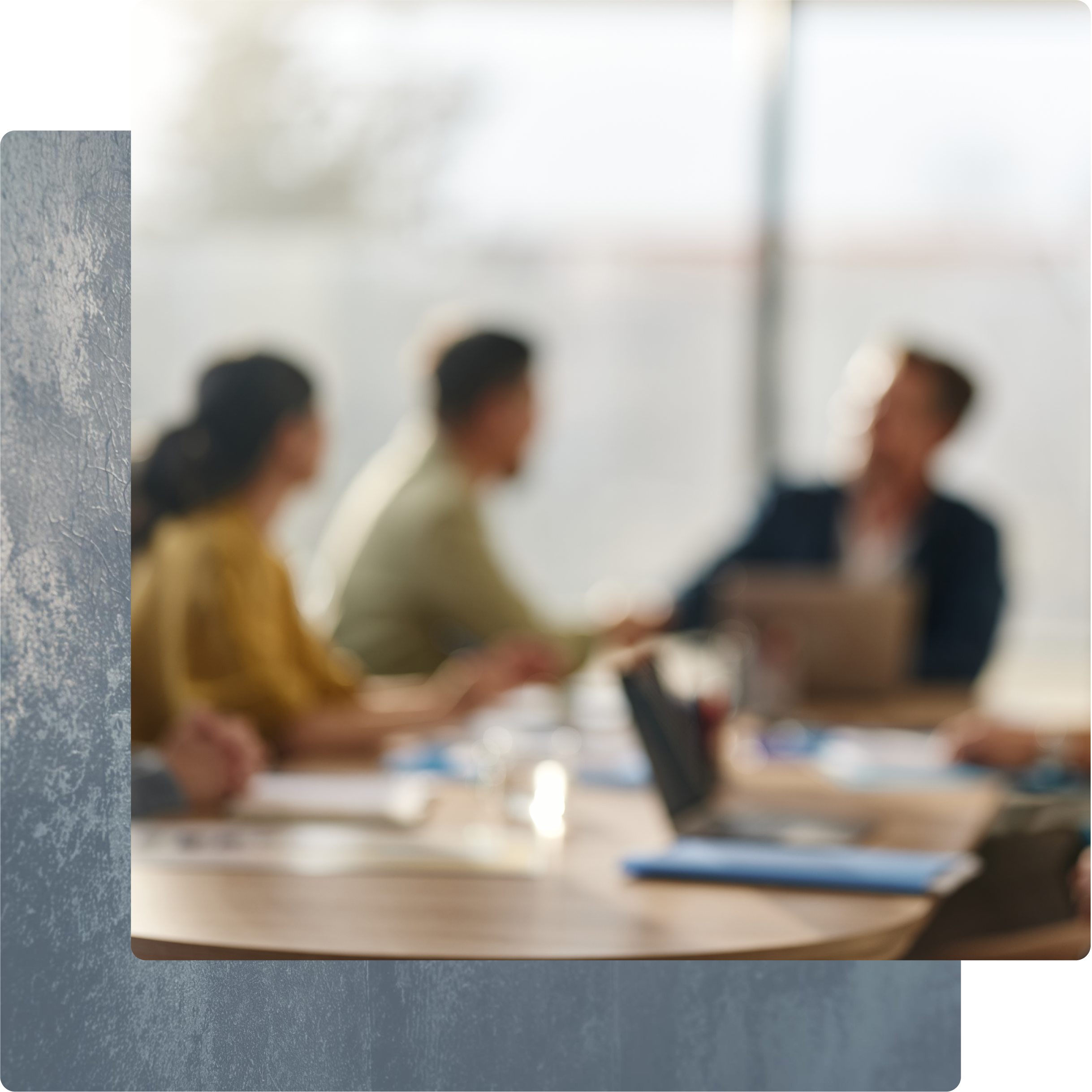 Colleagues collaborating in a bright, modern office space.